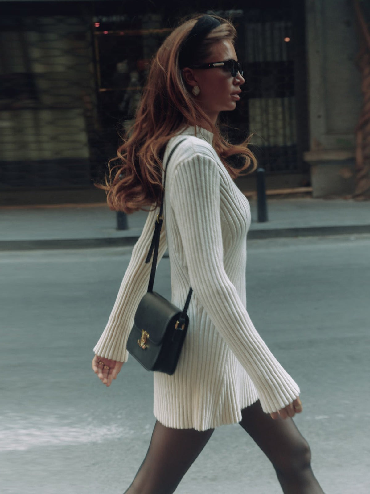 Long sleeved tight knit dress with a semi high collar and a base that covers the hips a solid color woolen dress eprolo