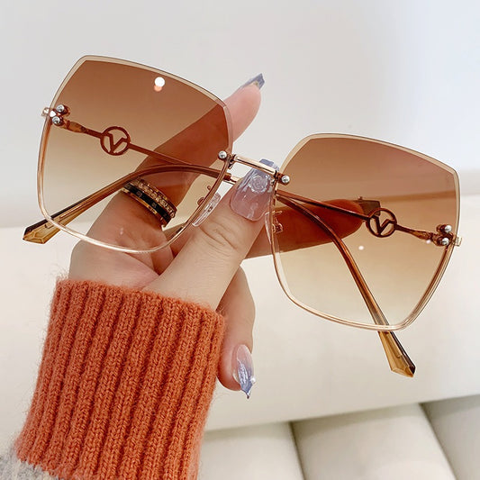 New Frameless Trimmed Sunglasses Women's Fashion Metal Large Frame Gradual Change Light Color Sunglasses Driving Sunvisors ins eprolo